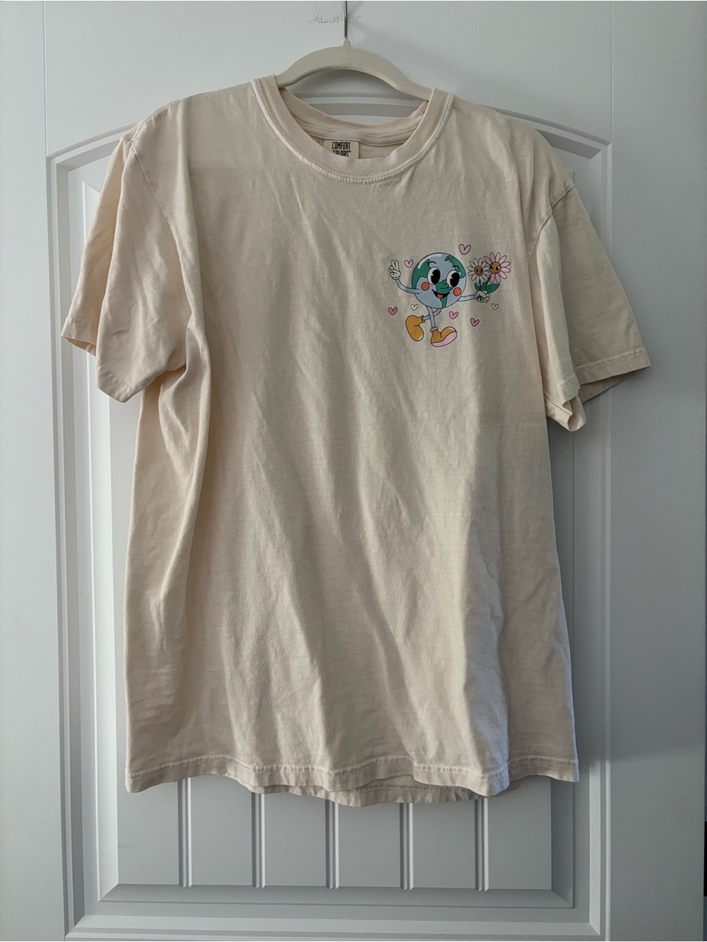 Comfort Colors Cream Short Sleeve Tee with Smiling Earth Graphic